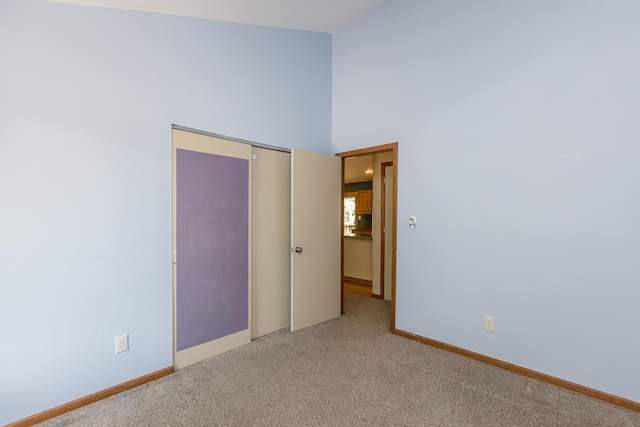 420 Stonehedge Pl, Lexington, KY 40517 - unfurnished room with baseboards, carpet, and a towering ceiling