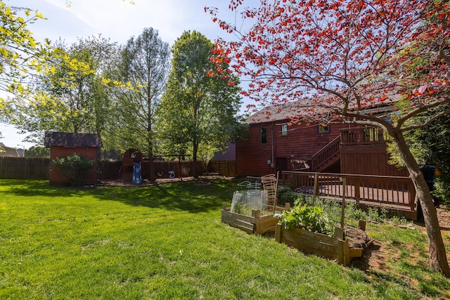 420 Stonehedge Pl, Lexington, KY 40517 - view of yard featuring stairs, a fenced backyard, a vegetable garden, and a storage shed