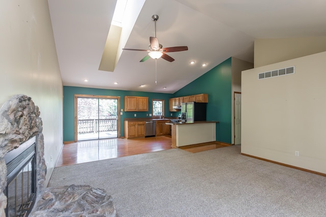 420 Stonehedge Pl, Lexington, KY 40517 - unfurnished living room featuring visible vents, a stone fireplace, ceiling fan, light colored carpet, and a sink