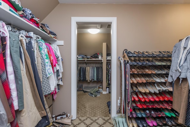 spacious closet with lofted ceiling