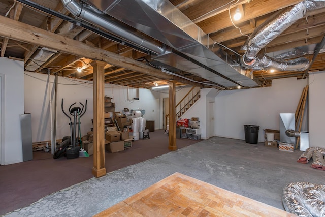 unfinished basement featuring stairs