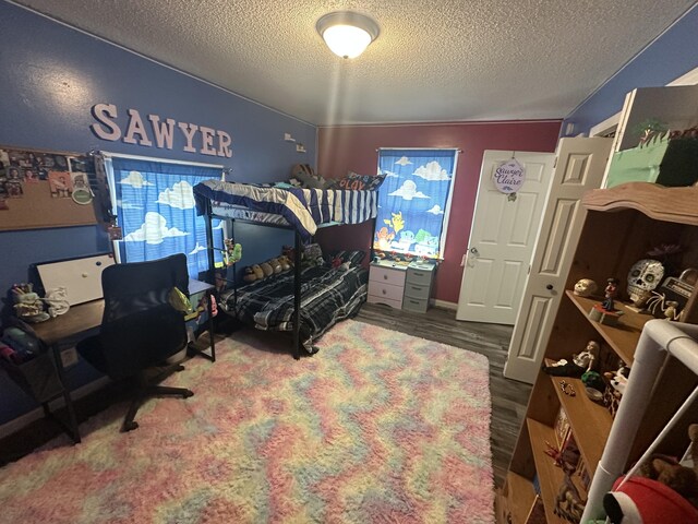91 Barnett Rd, Brodhead, KY 40409 - bedroom featuring a textured ceiling and wood finished floors