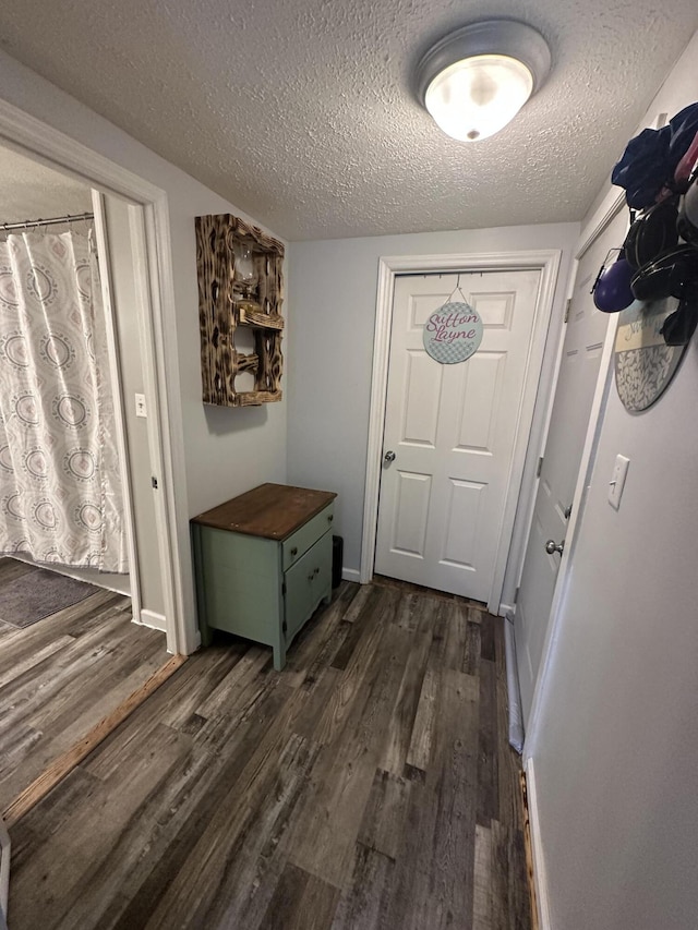 91 Barnett Rd, Brodhead, KY 40409 - doorway with a textured ceiling and dark wood finished floors