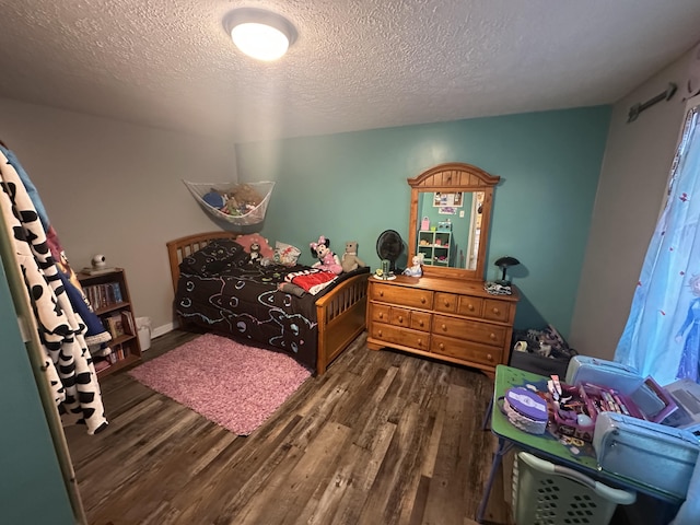 91 Barnett Rd, Brodhead, KY 40409 - bedroom with a textured ceiling and wood finished floors
