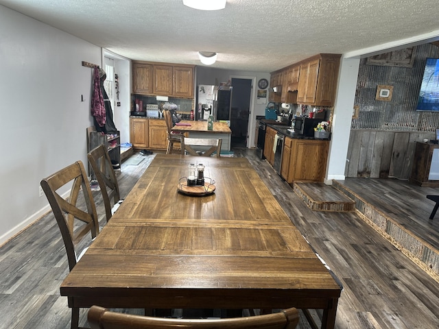 91 Barnett Rd, Brodhead, KY 40409 - dining room with a textured ceiling, dark wood finished floors, and baseboards