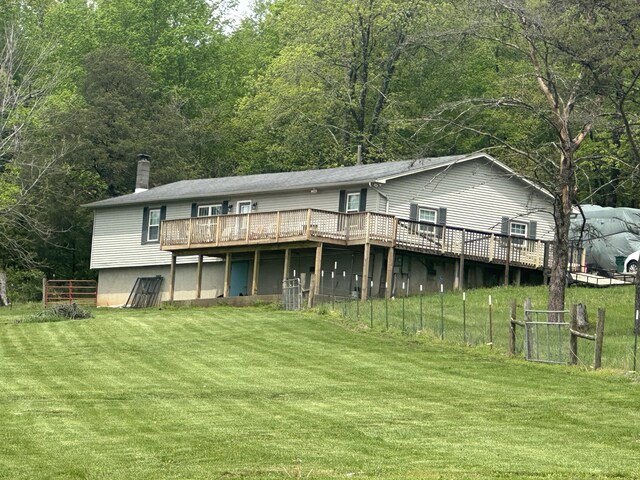 91 Barnett Rd, Brodhead, KY 40409 - back of house featuring fence, a chimney, a yard, and a wooden deck