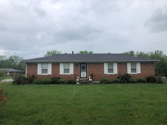 single story home with brick siding and a front lawn
