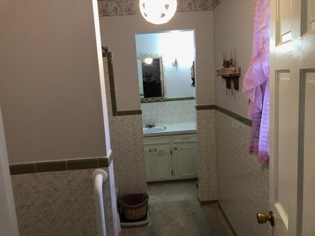 98 Lois St, Lawrenceburg, KY 40342 - bathroom with tile walls, a wainscoted wall, and vanity