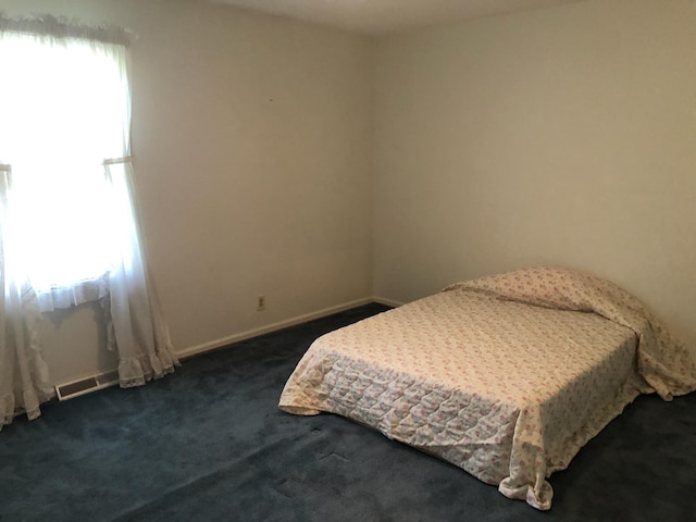 98 Lois St, Lawrenceburg, KY 40342 - bedroom featuring multiple windows, dark carpet, and baseboards