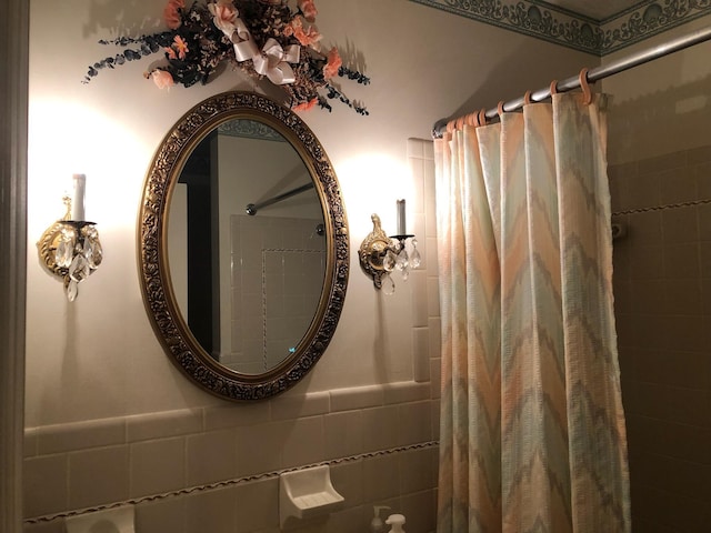 98 Lois St, Lawrenceburg, KY 40342 - bathroom view of a shower with shower curtain, a wainscoted wall, and tile walls