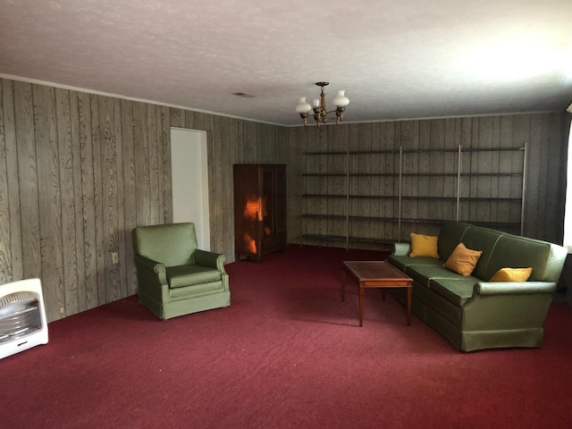 98 Lois St, Lawrenceburg, KY 40342 - living area with carpet floors, a chandelier, wooden walls, and heating unit