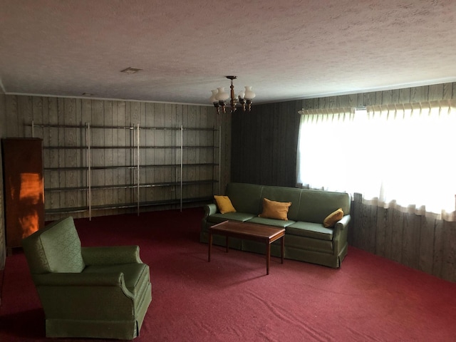 98 Lois St, Lawrenceburg, KY 40342 - living room with a chandelier, carpet, wooden walls, and a textured ceiling