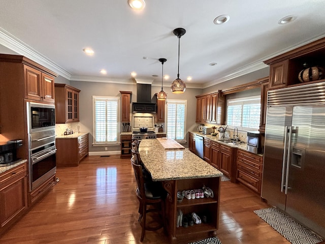 kitchen featuring custom exhaust hood, plenty of natural light, open shelves, and built in appliances