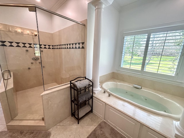 bathroom featuring crown molding, a jetted tub, a shower stall, and decorative columns