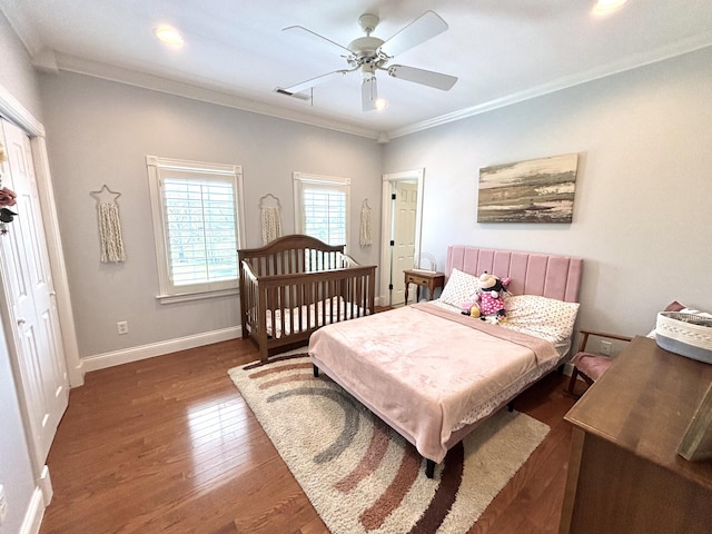 bedroom with recessed lighting, crown molding, visible vents, baseboards, and wood finished floors