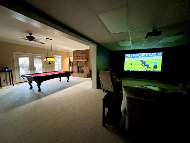 recreation room featuring french doors, pool table, a paneled ceiling, and carpet floors