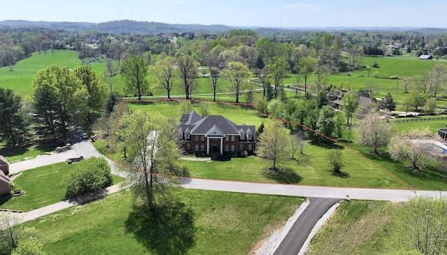 birds eye view of property featuring a rural view