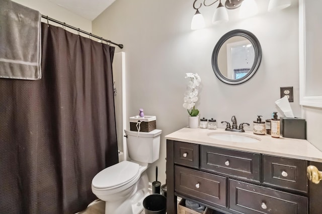 full bath featuring vanity, toilet, and curtained shower