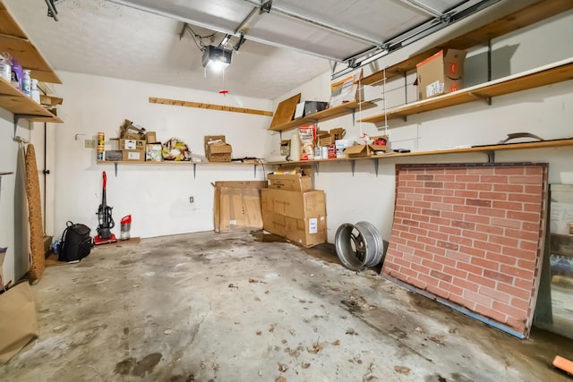 garage with a garage door opener and a workshop area
