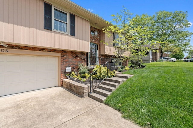 bi-level home with brick siding, a garage, a front lawn, and driveway