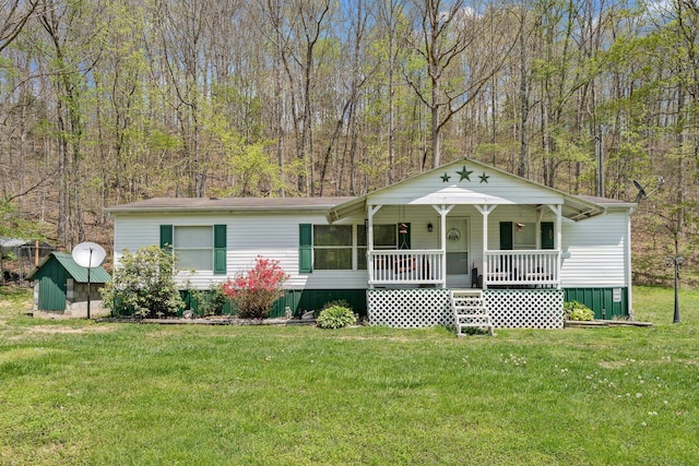 view of front of home with a porch and a front yard