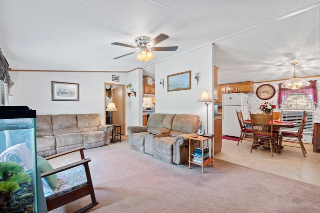 carpeted living room with ornamental molding and ceiling fan with notable chandelier