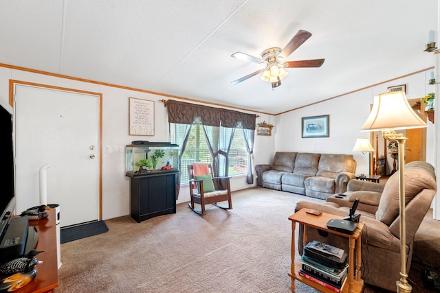 carpeted living area featuring ceiling fan, lofted ceiling, and crown molding