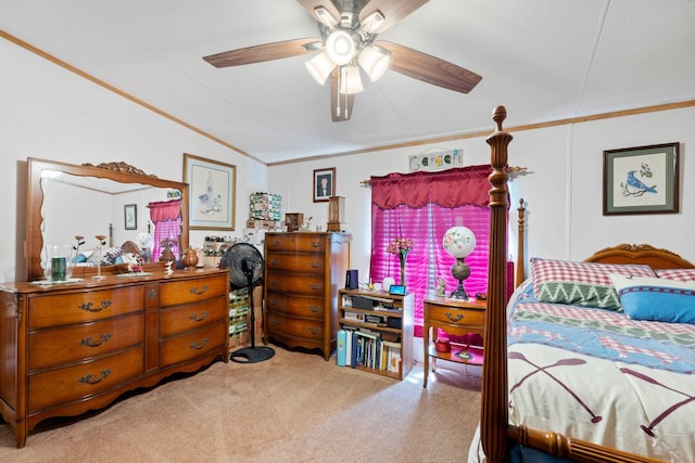 bedroom featuring ornamental molding, a ceiling fan, vaulted ceiling, and carpet