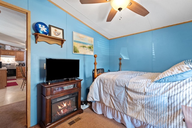 bedroom featuring visible vents, crown molding, and vaulted ceiling