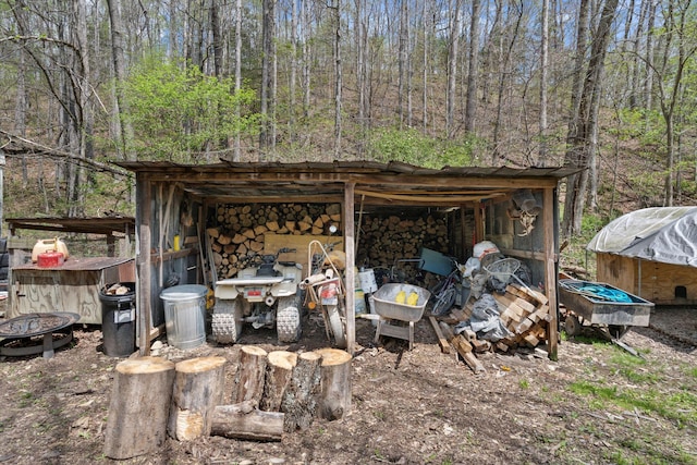 view of pole building featuring a forest view