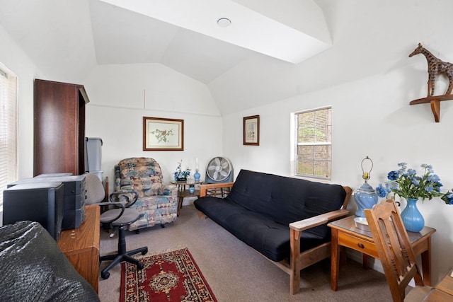 carpeted living room featuring vaulted ceiling