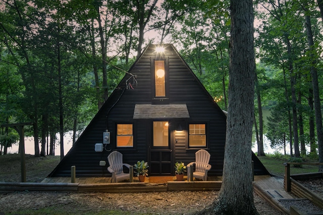 back of property with log veneer siding