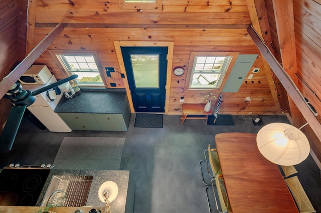 interior space with wooden walls and plenty of natural light