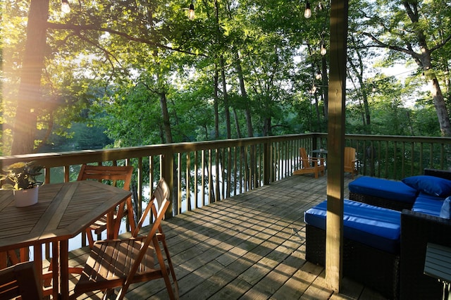 deck with outdoor dining area