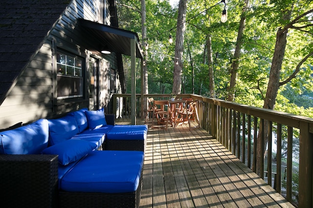 wooden terrace featuring outdoor lounge area