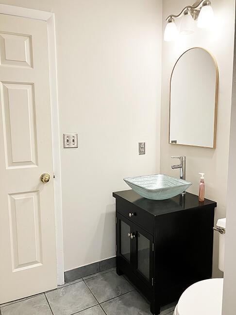 3426 Pepperhill Rd, Lexington, KY 40502 - half bath with vanity, toilet, baseboards, and tile patterned floors