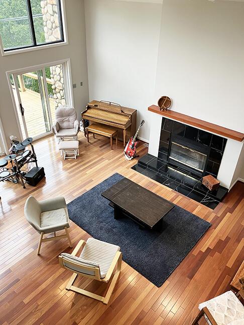 3426 Pepperhill Rd, Lexington, KY 40502 - living area with wood-type flooring, a tiled fireplace, and a high ceiling