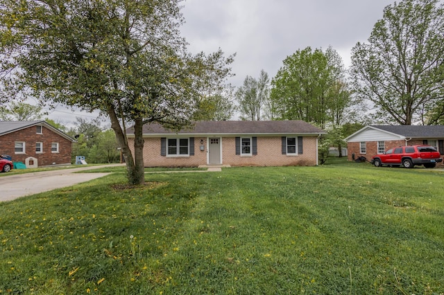 single story home featuring a front lawn, driveway, and brick siding