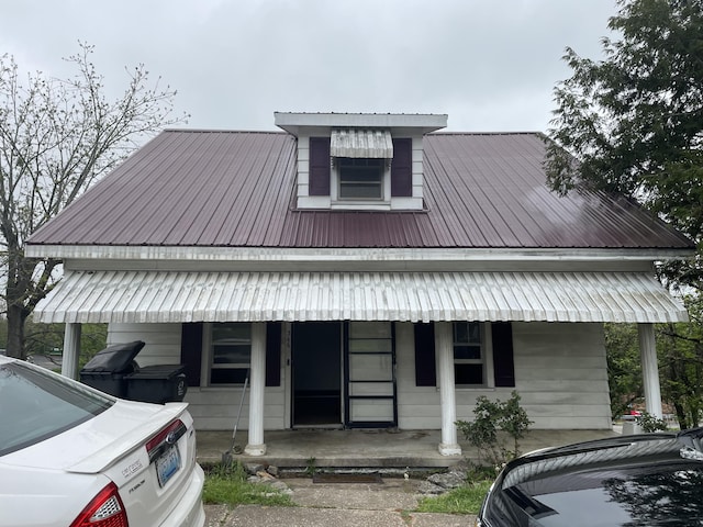 346 Slate Ave, Owingsville, KY 40360 - view of front facade featuring metal roof and a porch