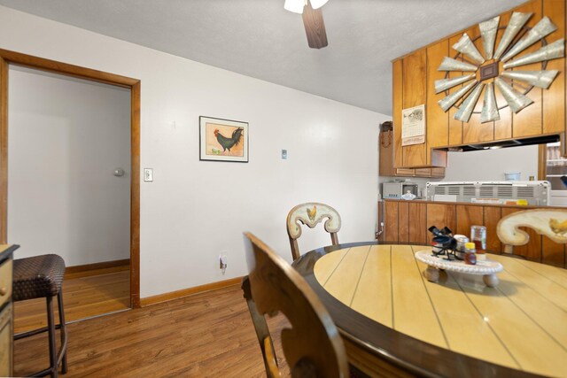 507 Holman Dr, Stanton, KY 40380 - dining space with wood finished floors, ceiling fan, and baseboards