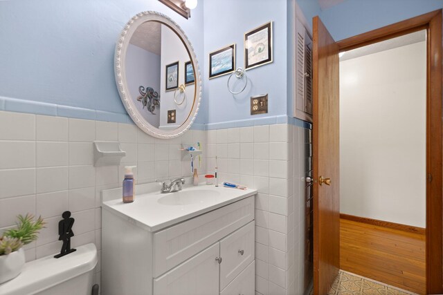 507 Holman Dr, Stanton, KY 40380 - bathroom with tile walls, vanity, wainscoting, and toilet