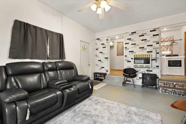 507 Holman Dr, Stanton, KY 40380 - living room featuring washer / clothes dryer, heating unit, concrete flooring, and a ceiling fan