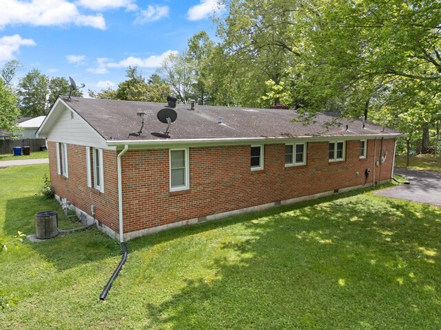 507 Holman Dr, Stanton, KY 40380 - back of house featuring brick siding, a shingled roof, a lawn, and crawl space