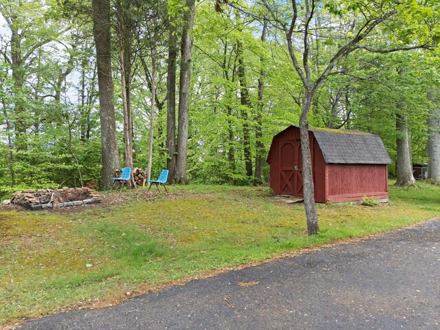 507 Holman Dr, Stanton, KY 40380 - view of grassy yard with a storage shed and an outdoor structure