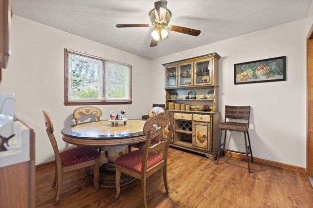 507 Holman Dr, Stanton, KY 40380 - dining area featuring light wood-type flooring, baseboards, and ceiling fan