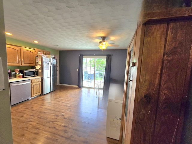 17 Jessica Way, Stanford, KY 40484 - kitchen with appliances with stainless steel finishes, baseboards, light countertops, light wood-type flooring, and ceiling fan