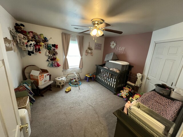 bedroom with ceiling fan and carpet floors