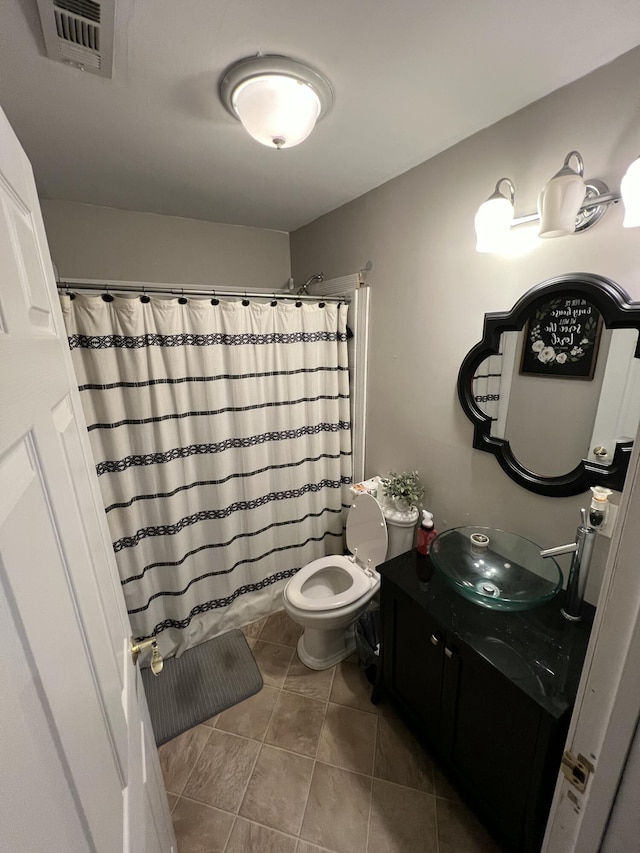 bathroom with visible vents, vanity, a shower with curtain, and tile patterned flooring