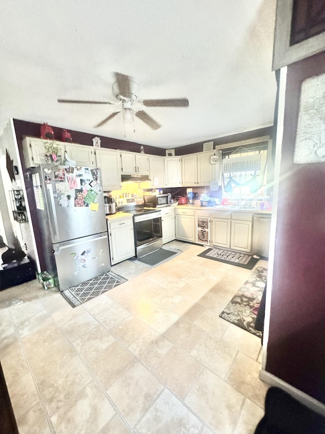 68 Red Witt Rd, Williamsburg, KY 40769 - kitchen featuring a sink, appliances with stainless steel finishes, beverage cooler, ceiling fan, and light countertops