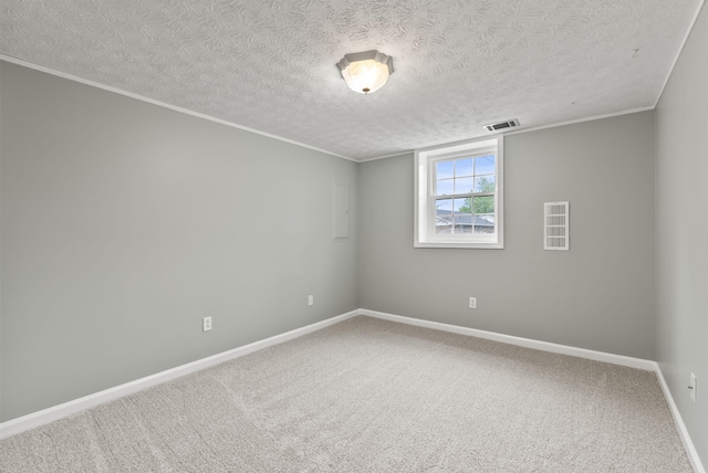 unfurnished room featuring carpet flooring, a textured ceiling, baseboards, visible vents, and ornamental molding